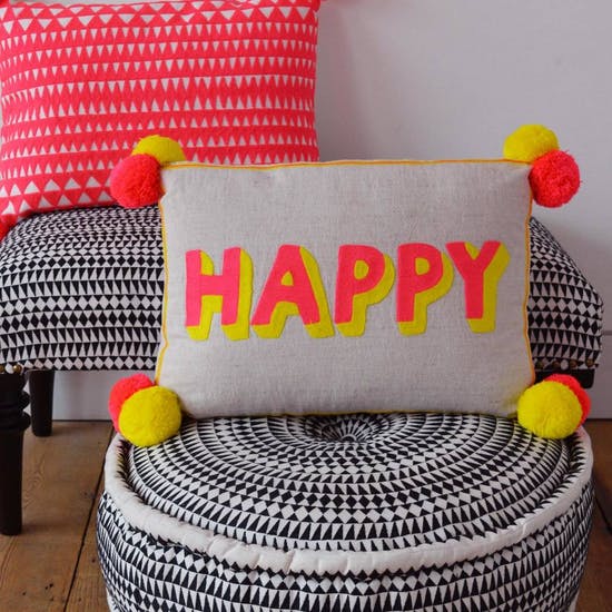 'Happy' Cushion with Pom Pom Design
