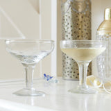 A Pair Of Champagne Coupes With Etched Stars