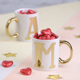 Gold Monogram Mug Filled With Heart Chocolate